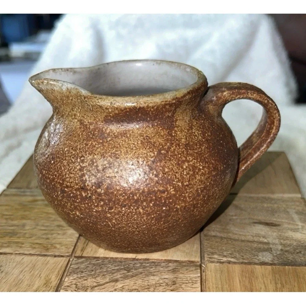 Redware  Pottery Creamer Pitcher Sponge Painted Brown. Interior White.